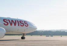 Passengers evacuating aircraft after engine fire on Delhi Zurich flight at Indira Gandhi International Airport with emergency teams responding quickly to the incident
