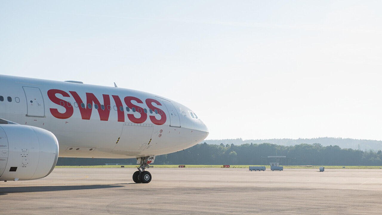 Passengers evacuating aircraft after engine fire on Delhi Zurich flight at Indira Gandhi International Airport with emergency teams responding quickly to the incident