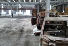 Abandoned Tata Motors Nano factory land in Singur showing damaged farmland and unused industrial site