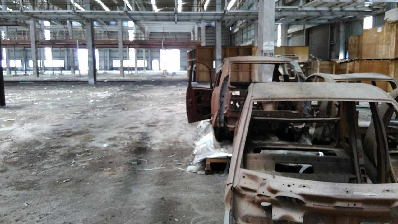 Abandoned Tata Motors Nano factory land in Singur showing damaged farmland and unused industrial site